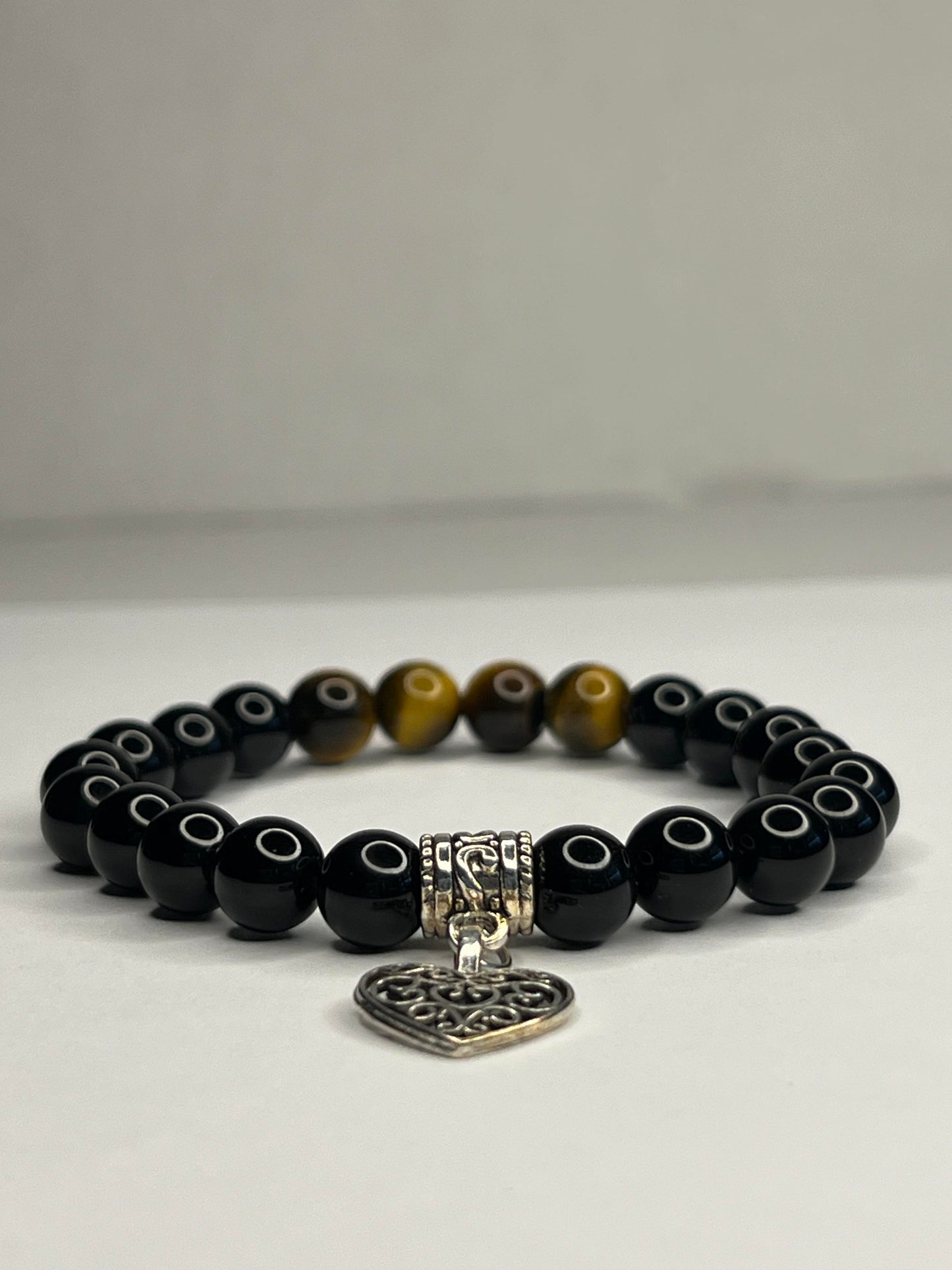 Yellow Tiger eye and Obsidian with steel Heart Charm