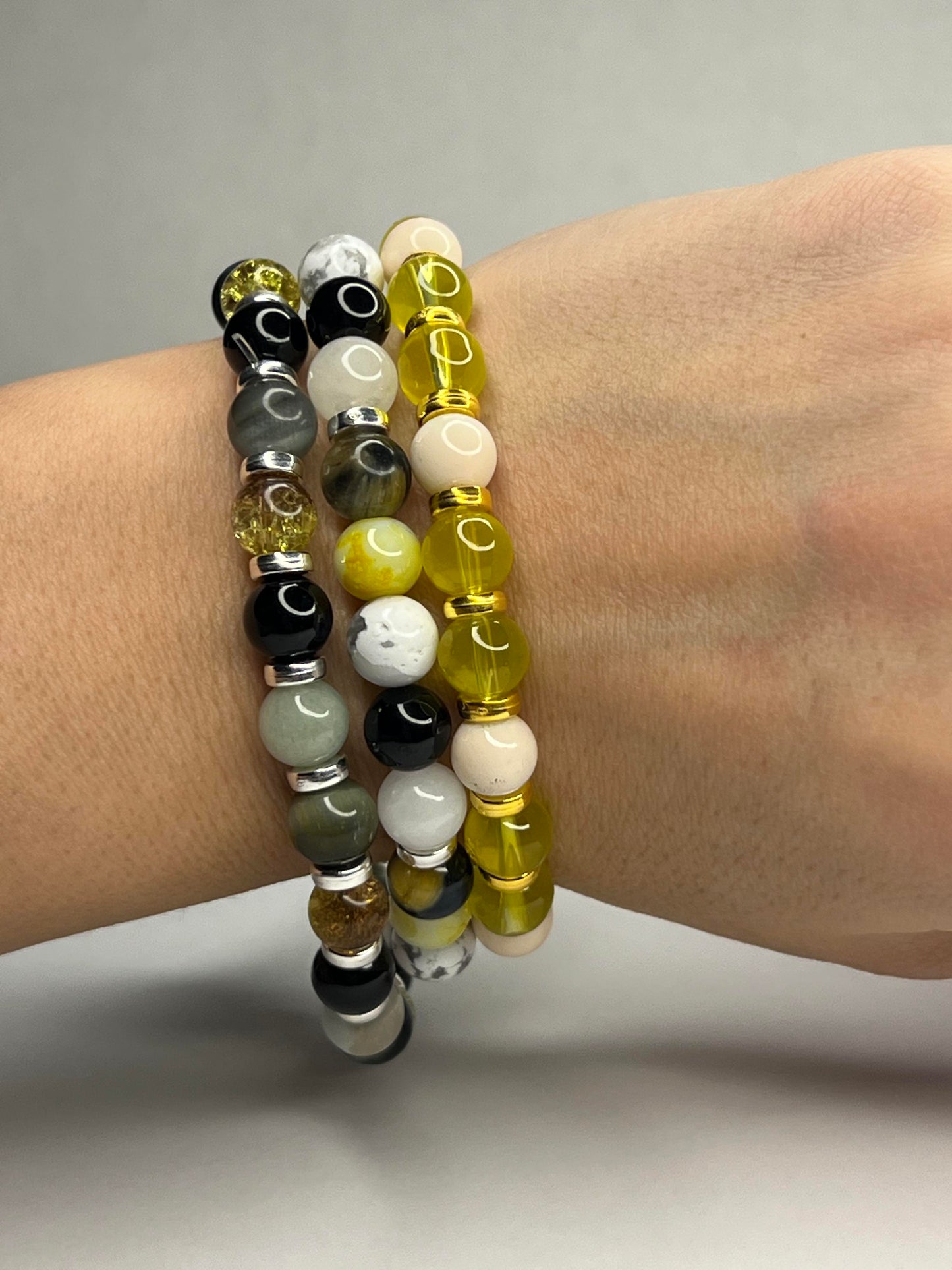 Citrine and Yellow Tiger eye, Pure white quartz, Onyx and Howlite with steel